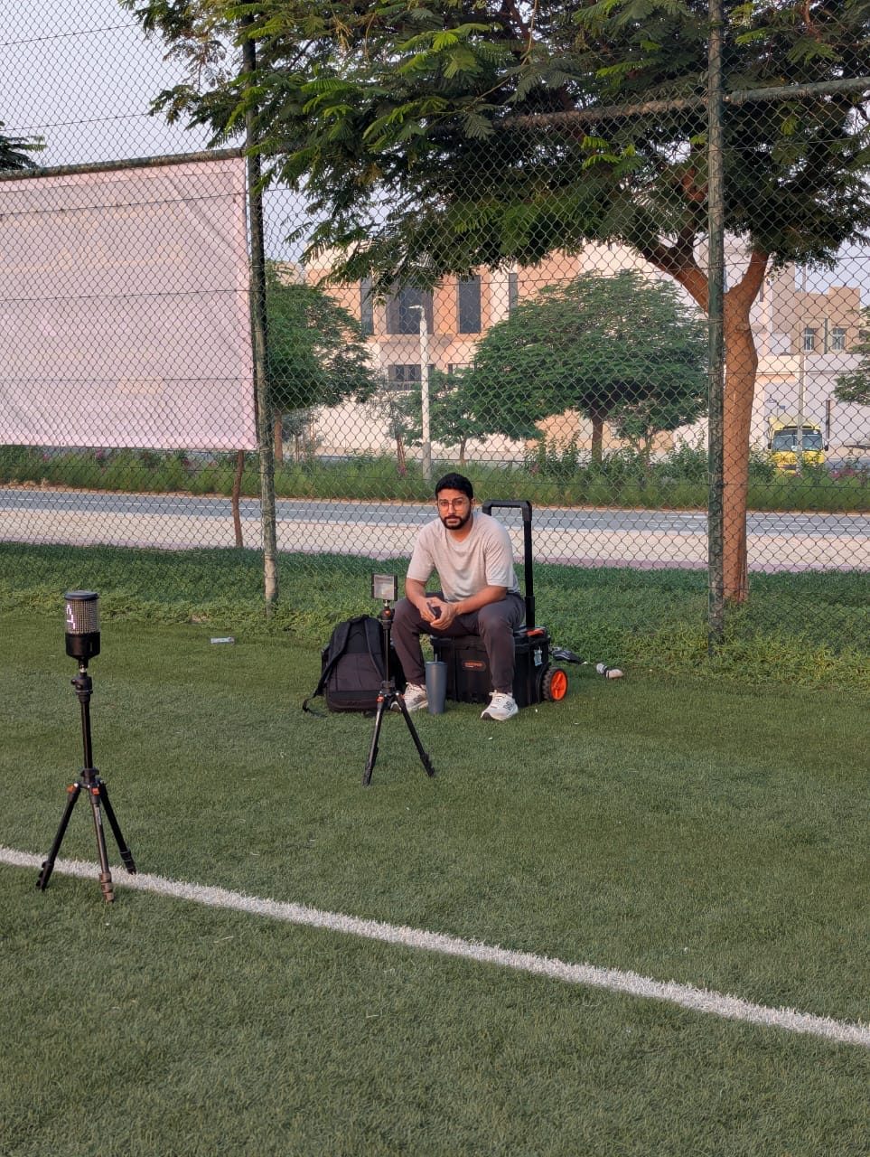 Yasser setting up timing gates on the pitch